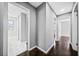 Hallway featuring hardwood floors and doorways leading to various rooms, including a bathroom at 2814 Lloyd Rd, Decatur, GA 30034