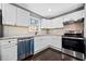 Modern kitchen with white cabinets, stainless steel appliances, and subway tile backsplash at 2814 Lloyd Rd, Decatur, GA 30034