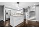 Well-lit kitchen with an island, stainless steel appliances, hardwood floors, and modern lighting at 2814 Lloyd Rd, Decatur, GA 30034