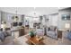 Spacious living room flows into the dining area, featuring hardwood floors and modern furniture at 2814 Lloyd Rd, Decatur, GA 30034