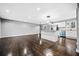 Open floor plan with stainless steel appliances, hardwood floors, updated lighting, and modern design at 2814 Lloyd Rd, Decatur, GA 30034