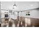 Open concept living room featuring hardwood floors, stainless steel appliances, and recessed lighting at 2814 Lloyd Rd, Decatur, GA 30034