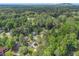 Establishing aerial shot of neighborhood showing home among a treed community at 5346 Kelleys Mill Cir, Stone Mountain, GA 30088