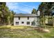 Expansive backyard view of home showing the lawn, and trimmed trees giving privacy at 5346 Kelleys Mill Cir, Stone Mountain, GA 30088