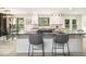 Bright, updated kitchen with a center island, black counter tops, and bar stool seating at 5346 Kelleys Mill Cir, Stone Mountain, GA 30088