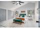 Bright main bedroom with vaulted ceiling, two closets, a ceiling fan, and large windows overlooking backyard at 5346 Kelleys Mill Cir, Stone Mountain, GA 30088