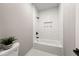 A bathroom with white subway tile around the shower/tub combo, black hardware and neutral walls at 939 Whistler Ln, Canton, GA 30114