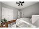 A bedroom with hardwood floors, large closet, and ample space at 939 Whistler Ln, Canton, GA 30114