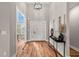 Grand entryway boasts soaring ceilings, stylish light fixtures, and beautiful hardwood floors, creating a welcoming ambiance at 939 Whistler Ln, Canton, GA 30114