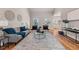 Stylish living room showcasing hardwood floors, modern furnishings, and ample space for relaxation and gatherings at 939 Whistler Ln, Canton, GA 30114