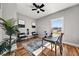 An office space with hardwood floors, a ceiling fan, a desk and lots of natural light from the window at 939 Whistler Ln, Canton, GA 30114