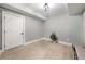 Bright room with light floors, a modern light fixture, and neutral decor at 939 Whistler Ln, Canton, GA 30114