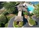 Aerial shot shows the community clubhouse, pool, playground, tennis courts, and lush green landscaping at 940 River Valley Dr, Dacula, GA 30019