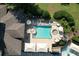 Aerial view of an outdoor pool with surrounding lounge chairs and umbrellas at 940 River Valley Dr, Dacula, GA 30019