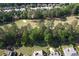 Beautiful aerial view of lush landscaping and a golf course in the distance at 940 River Valley Dr, Dacula, GA 30019