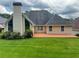 Expansive backyard featuring a well-maintained lawn and cozy patio area, perfect for outdoor living at 940 River Valley Dr, Dacula, GA 30019