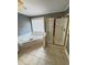 This bathroom features a corner tub and standing shower with a gold frame at 940 River Valley Dr, Dacula, GA 30019
