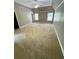Spacious bedroom with vaulted ceiling and two windows at 940 River Valley Dr, Dacula, GA 30019