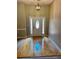 Bright foyer features a wood floor and a front door with decorative glass side panels at 940 River Valley Dr, Dacula, GA 30019
