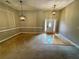 View of the home's foyer, showcasing the front door with sidelights and wood flooring at 940 River Valley Dr, Dacula, GA 30019