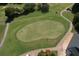 Aerial view of a lush green golf course with mature trees and manicured grounds, perfect for outdoor recreation and enjoying the scenery at 940 River Valley Dr, Dacula, GA 30019