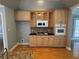 Kitchen featuring custom wood cabinets, granite countertops, tile backsplash, and stainless steel appliances at 940 River Valley Dr, Dacula, GA 30019