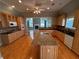 Well-equipped kitchen boasts wood cabinets, granite countertops, an island, and stainless steel appliances at 940 River Valley Dr, Dacula, GA 30019