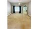 Expansive living room with high ceilings, a large window, and double doors to another room at 940 River Valley Dr, Dacula, GA 30019