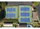 Aerial view of well maintained tennis courts and lush green landscaping and trees on a sunny day at 940 River Valley Dr, Dacula, GA 30019