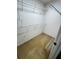 Walk-in closet with carpet floors and multiple wire rack shelves for storage at 940 River Valley Dr, Dacula, GA 30019