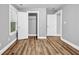 Cozy bedroom featuring two closets, wood floors, and natural light at 1714 Boulder Walk Se Ln, Atlanta, GA 30316