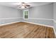 Large bedroom with wood floors, natural light, and neutral color palette at 1714 Boulder Walk Se Ln, Atlanta, GA 30316