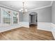 Elegant dining room with hardwood floors, wainscoting, and a stylish chandelier for a refined feel at 1714 Boulder Walk Se Ln, Atlanta, GA 30316