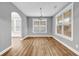 Sunlit dining room with hardwood floors, neutral paint, and large windows for natural light at 1714 Boulder Walk Se Ln, Atlanta, GA 30316