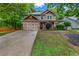 Charming two-story home featuring a well-maintained lawn and a spacious two-car garage at 1714 Boulder Walk Se Ln, Atlanta, GA 30316