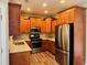 Well-lit kitchen with stainless steel appliances, wooden cabinetry, and granite countertops at 1714 Boulder Walk Se Ln, Atlanta, GA 30316