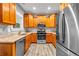 Well-equipped kitchen with stainless steel appliances, granite countertops, and wood cabinetry at 1714 Boulder Walk Se Ln, Atlanta, GA 30316