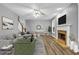 Stylish staged living room with hardwood floors, fireplace, ceiling fan, and comfortable seating at 1714 Boulder Walk Se Ln, Atlanta, GA 30316