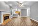 Open-concept living room showcasing hardwood floors, a fireplace, and view of the kitchen at 1714 Boulder Walk Se Ln, Atlanta, GA 30316