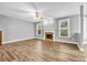 Spacious living room with hardwood floors, fireplace, ceiling fan, and plenty of natural light at 1714 Boulder Walk Se Ln, Atlanta, GA 30316