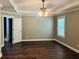 Main bedroom boasts trey ceilings, wood floors, a ceiling fan, and ample natural light at 1714 Boulder Walk Se Ln, Atlanta, GA 30316