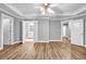 Bright main bedroom boasts a tray ceiling, hardwood floors, and ensuite bathroom access at 1714 Boulder Walk Se Ln, Atlanta, GA 30316