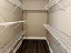 Walk-in closet features sturdy shelving and provides ample storage space at 1714 Boulder Walk Se Ln, Atlanta, GA 30316
