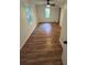 Bedroom showcasing wood floors, natural light, and a ceiling fan, offering a welcoming atmosphere at 1766 Venetian Sw Dr, Atlanta, GA 30311