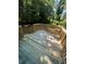 Spacious backyard deck for outdoor enjoyment and relaxation with lush greenery at 1766 Venetian Sw Dr, Atlanta, GA 30311