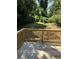 Wooden deck with railing overlooking a lush green backyard at 1766 Venetian Sw Dr, Atlanta, GA 30311