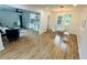 Bright and airy living room featuring wood floors and a modern open layout with a dining area at 1766 Venetian Sw Dr, Atlanta, GA 30311