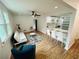 Spacious living area with open concept design flowing into dining area and kitchen at 1766 Venetian Sw Dr, Atlanta, GA 30311