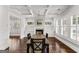 Charming dining room with hardwood floors, a fireplace, and plenty of natural light at 1898 Walker Ave, College Park, GA 30337