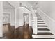 Spacious foyer with hardwood floors and a grand staircase leading to the upper level at 1898 Walker Ave, College Park, GA 30337
